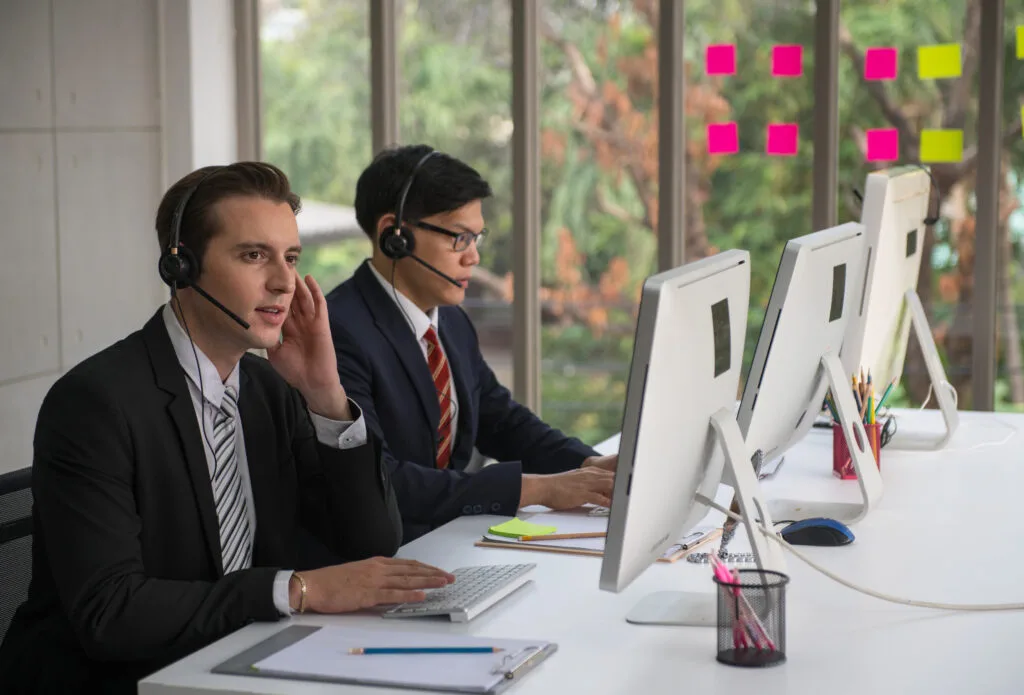 customer service representatives working office scaled Fabriclean %separatorst lauundry in uae